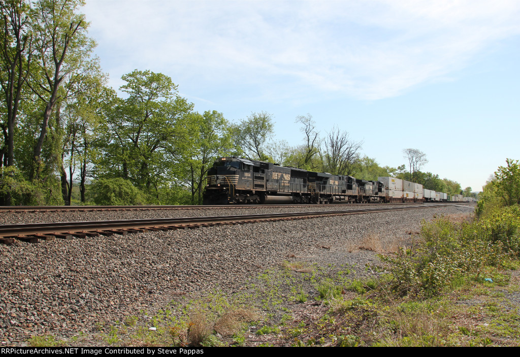 NS 1804 takes train 25G west at Milepost 116 through Cove PA